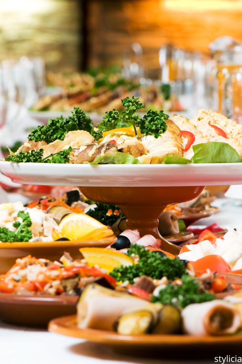 Eco-friendly wedding catering with fresh vegetables, herbs, and colourful salads on serving plates