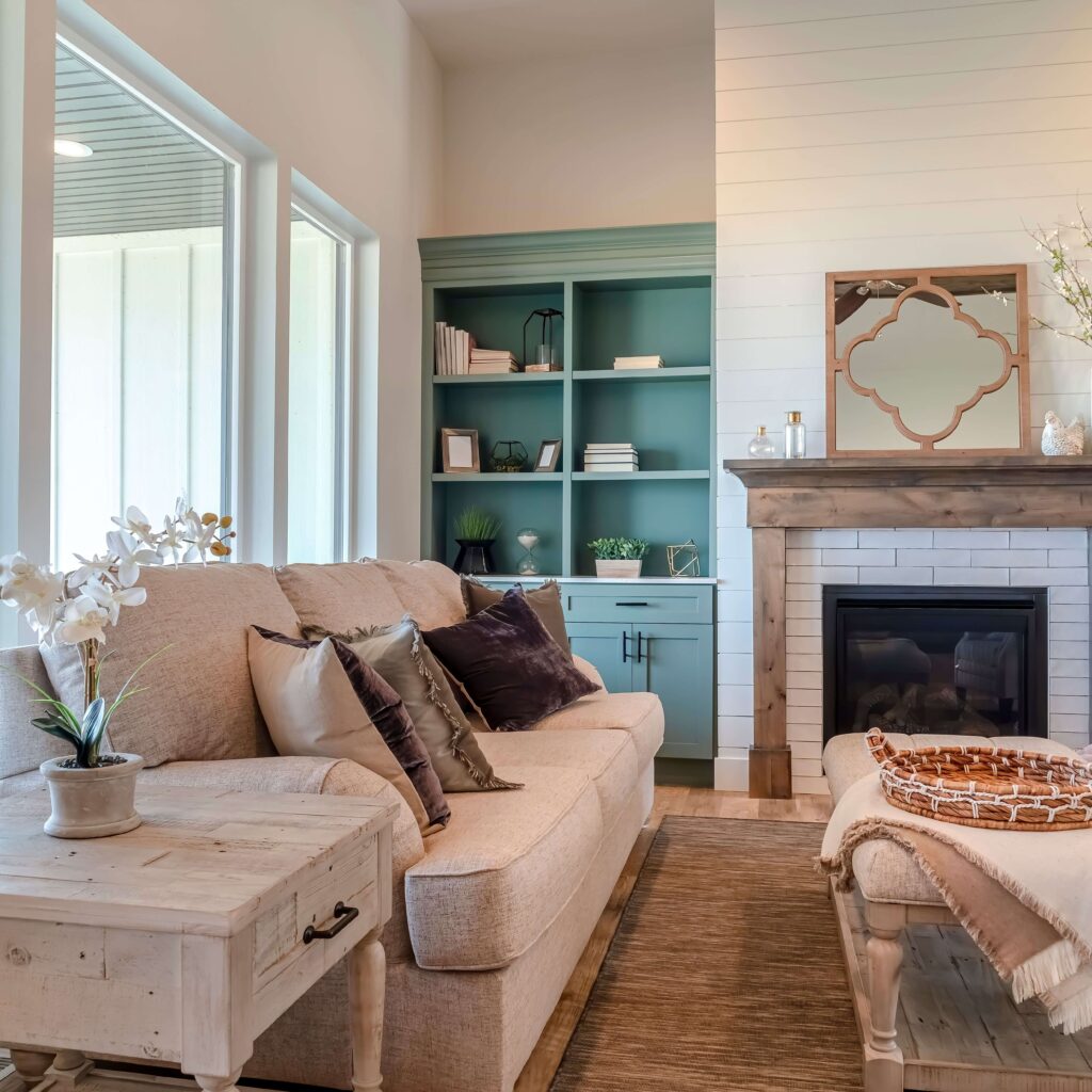 Brick fireplace with shiplap wall and built-ins — the perfect mix of rustic and modern farmhouse design.