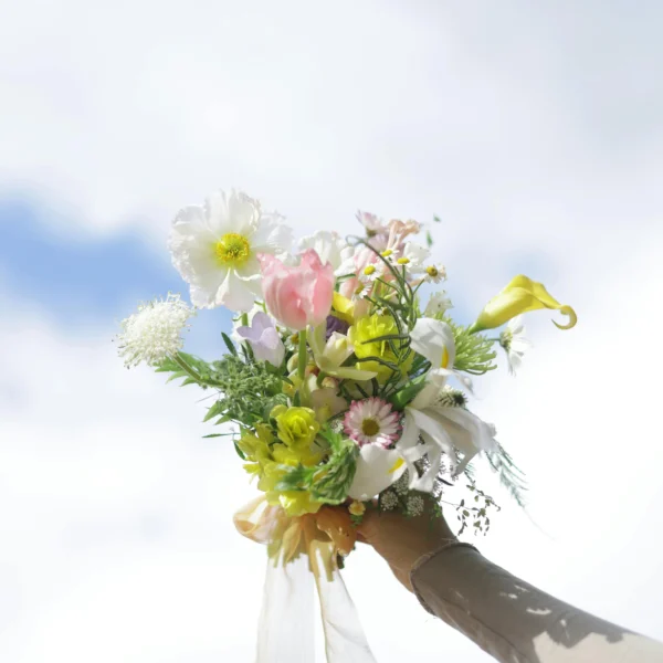 blush and cream wedding bouquet with cosmos and ranunculus