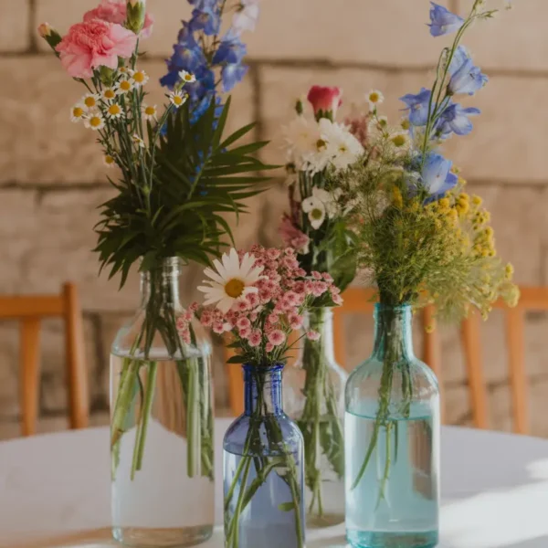 bud vase centrepiece with mixed wildflowers for wedding