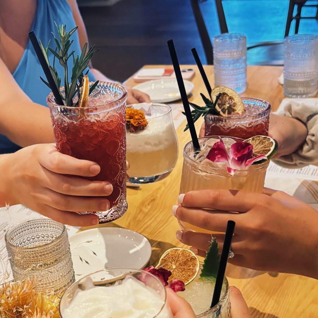 Cinnamon Plum Punch winter mocktails served with cinnamon sticks, rosemary, and dried citrus — a cozy non-alcoholic drink perfect for festive gatherings.
