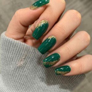 dark green Christmas nails 2025 with gold glitter ombre tips