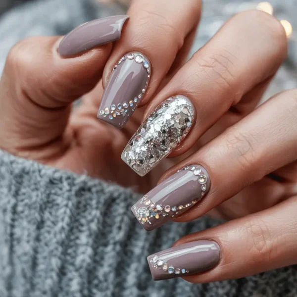 Long coffin fall nails — taupe rosewood mauve with rhinestone cuticle detail and silver chunky glitter accent nail
