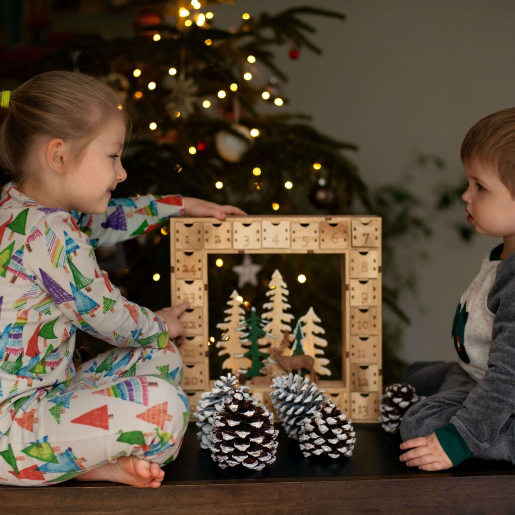 Child- and pet-friendly Christmas coffee table decor using LED candles and soft fabric ornaments