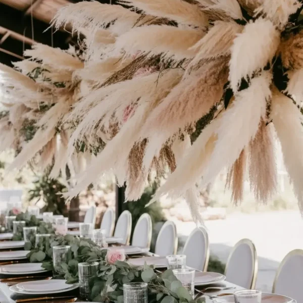 long banquet table set with wildflower centrepieces