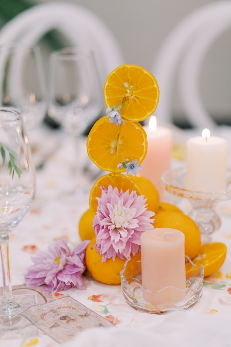 Citrus slices in white bowl on marble surface - dining table decor