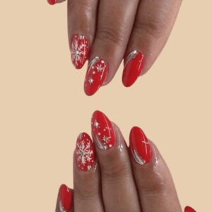 red Christmas nails 2025 with white snowflakes