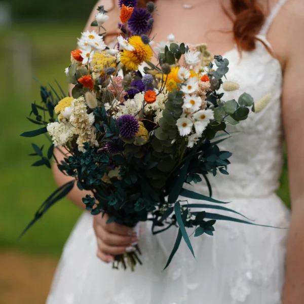 wildflower wedding decoration ideas – loose bridal bouquet with cornflowers and cosmos