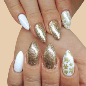 white and gold Christmas nails 2025 with glitter and snowflake details