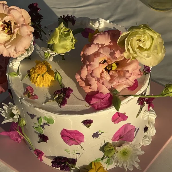 wildflower wedding cake decorated with fresh cornflowers and sweet peas
